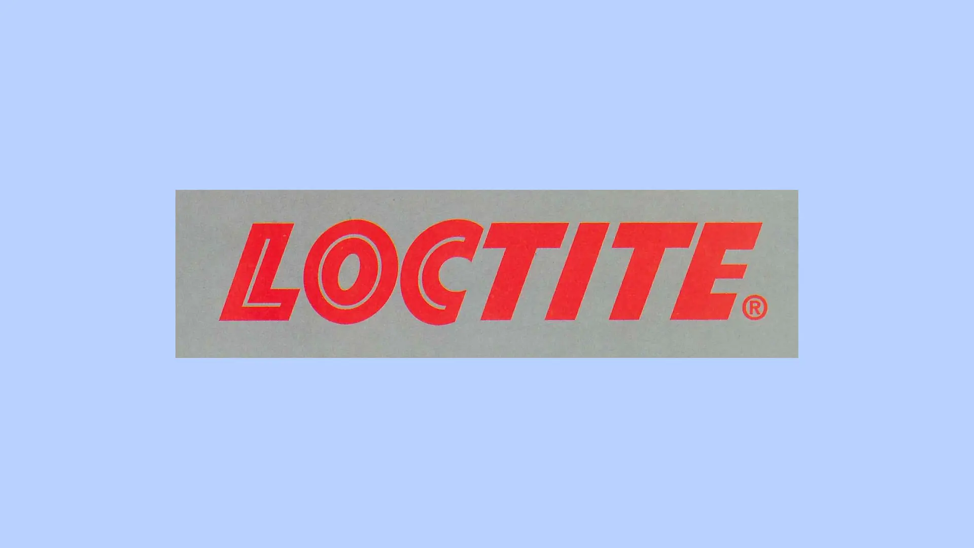 Crveni Loctite logo na sivoj pozadini.
